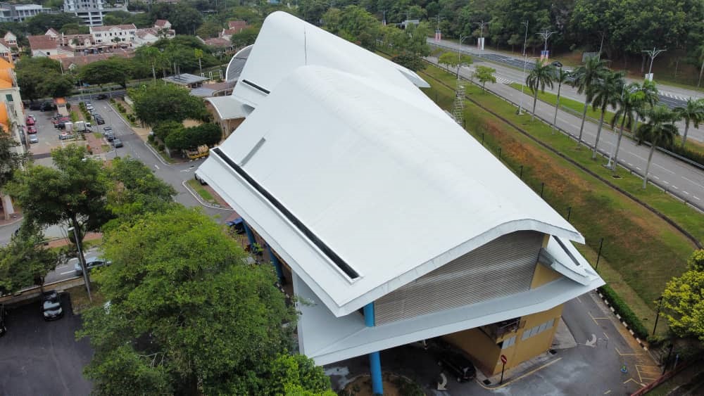 Commercial metal roof coating on curved structure